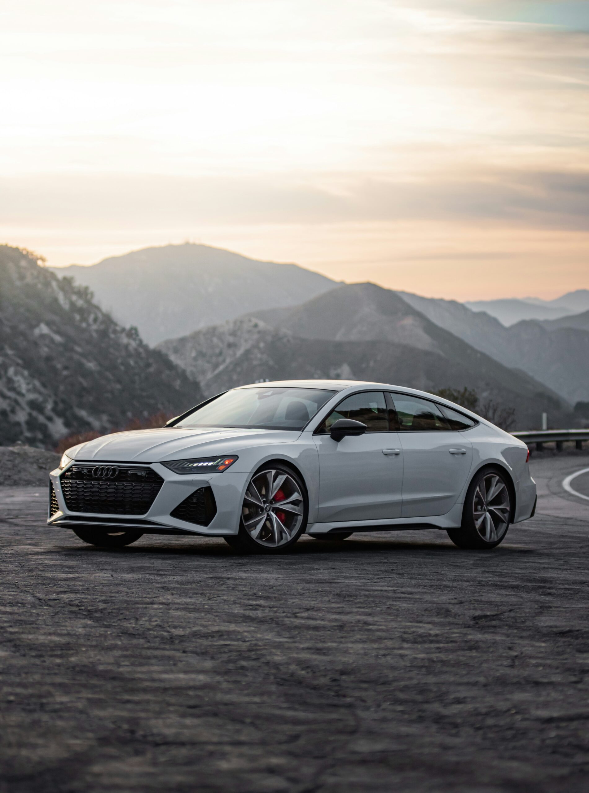 White Audi with mountain background
